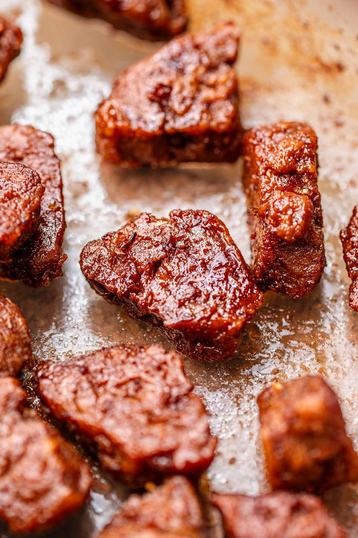 baked vegan beef tips in a glass baking dish.