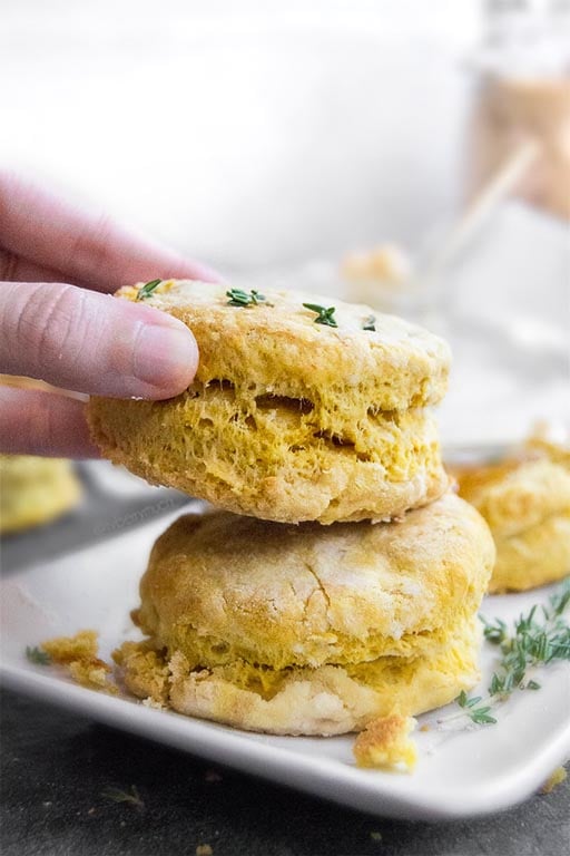 hand grabbing vegan pumpkin biscuits
