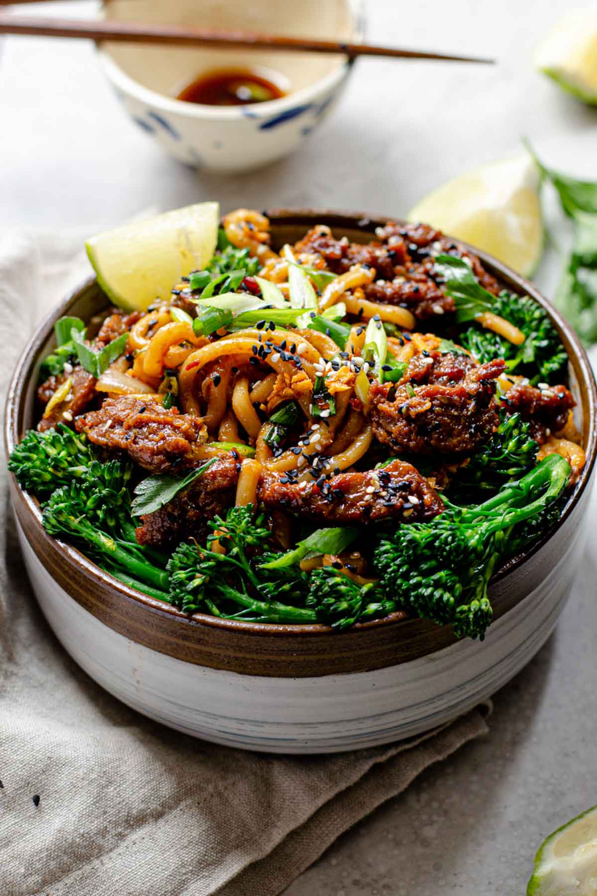 homemade vegan seitan beef with noodles and broccoli.