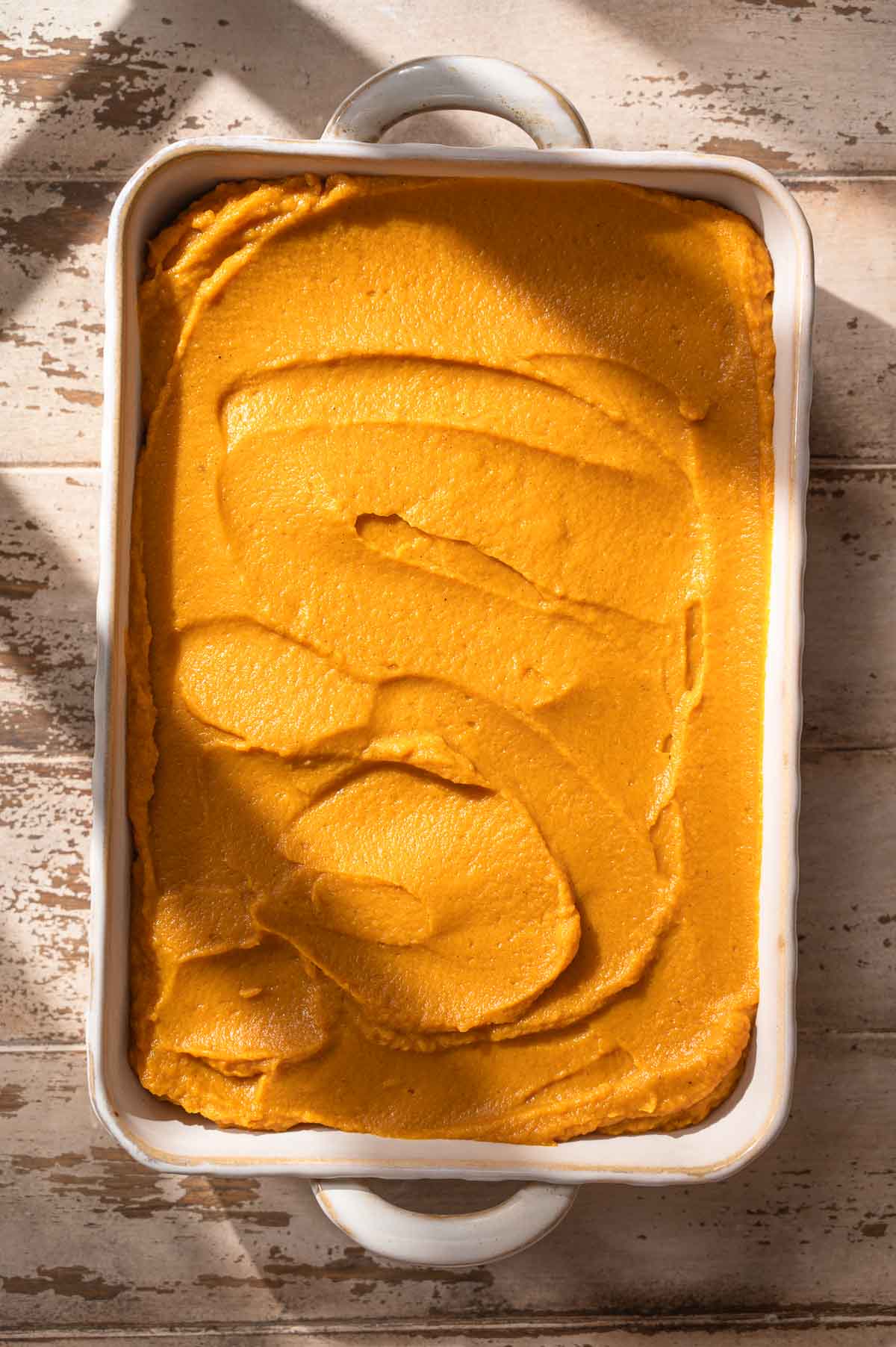 the blended vegan sweet potato casserole filling in a baking dish.