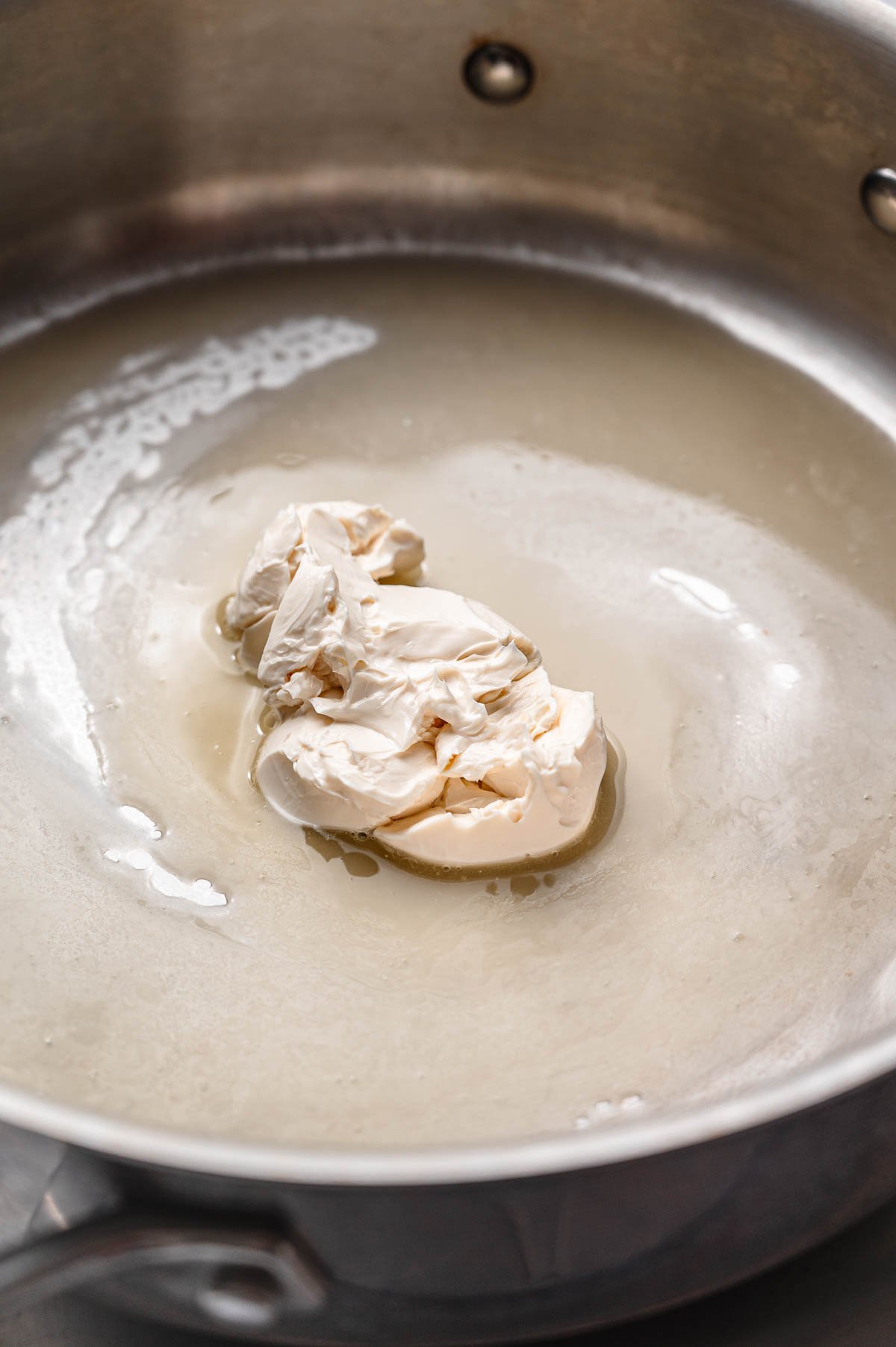 melted vegan butter in a stainless steel pan.