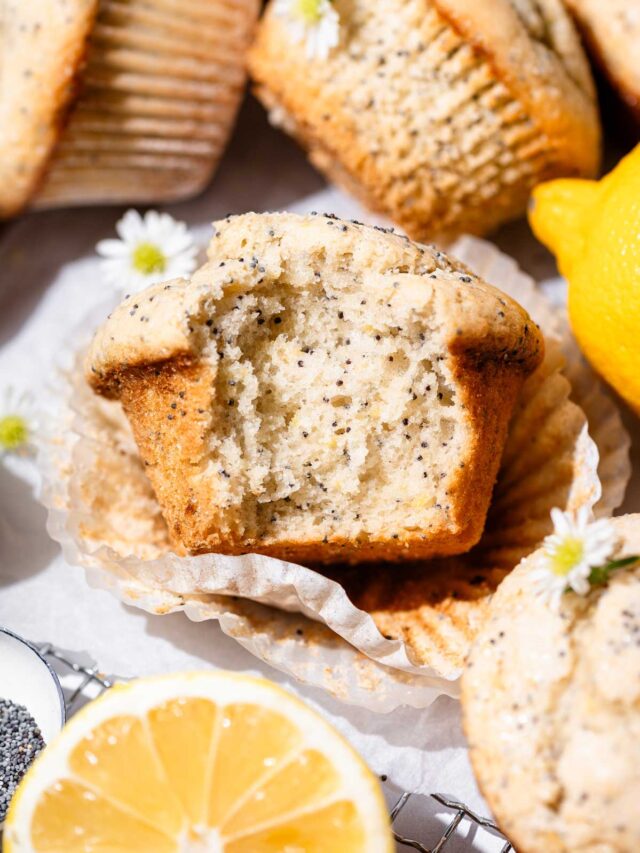 vegan lemon poppy seed muffins in a muffin wrapper.