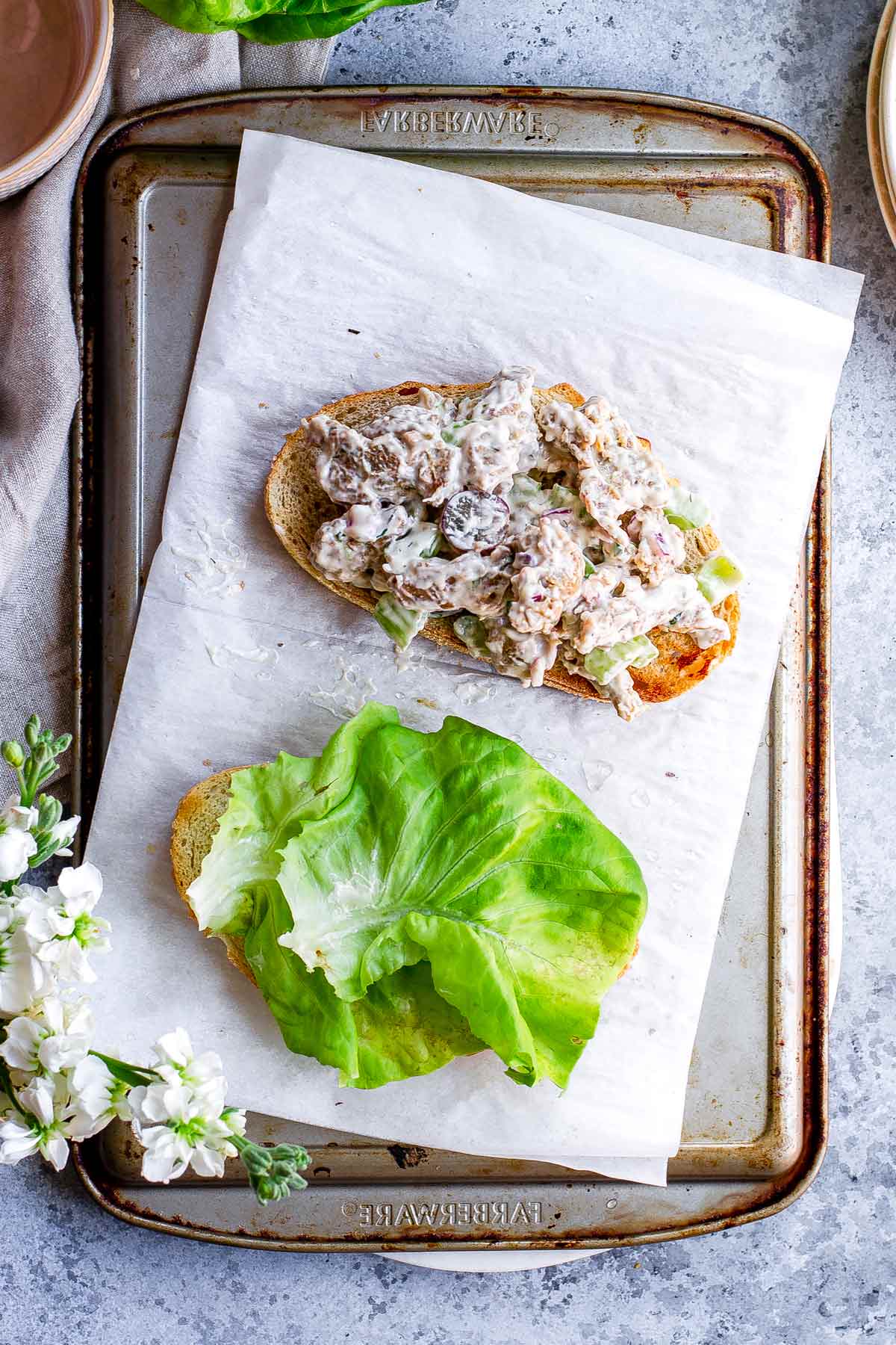 the seitan chicken salad piled on a piece of sourdough.