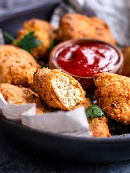 vegan air fryer tofu nuggets in a basket.