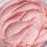 the creamy vegan strawberry buttercream in a large glass bowl.