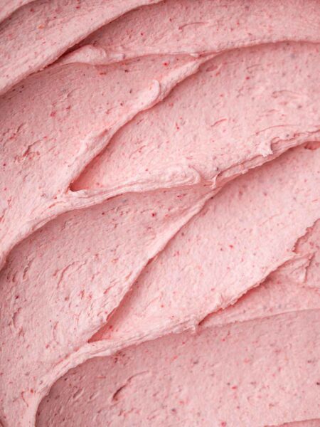 a close up of vegan strawberry buttercream frosting.