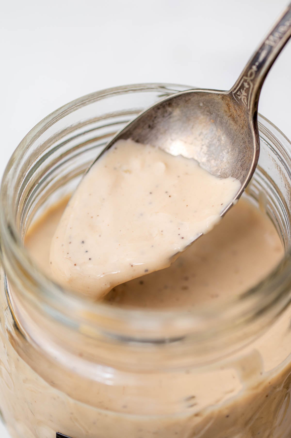 caesar dressing without anchovies on a spoon.