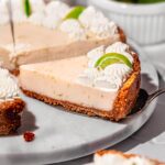 a slice of the best vegan key lime pie with dairy free whipped cream.