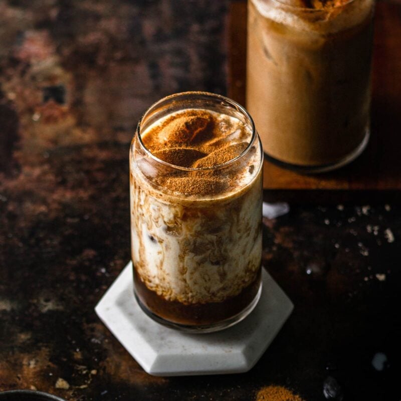 a pumpkin brown sugar shaken espresso in a serving glass.