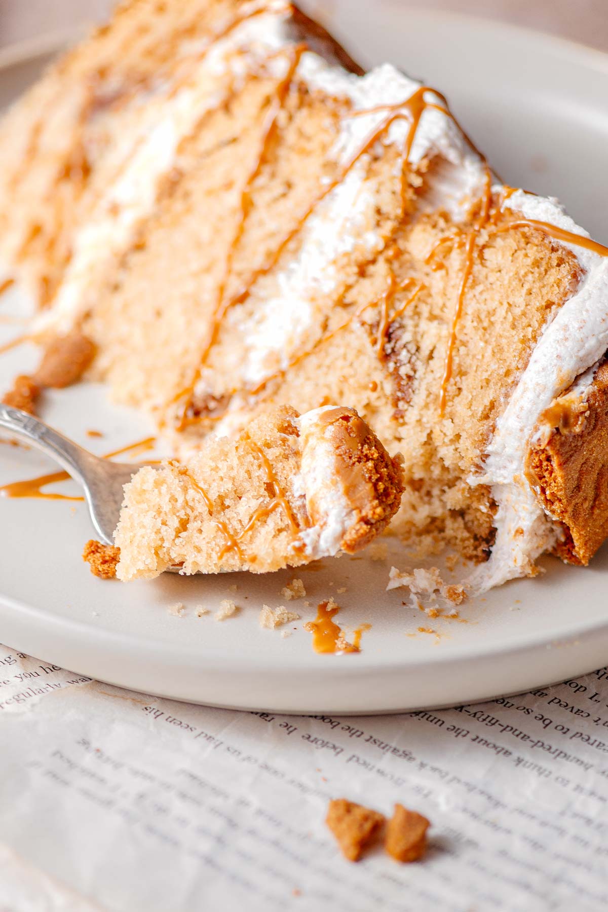 a piece of vegan biscoff cake on a fork.