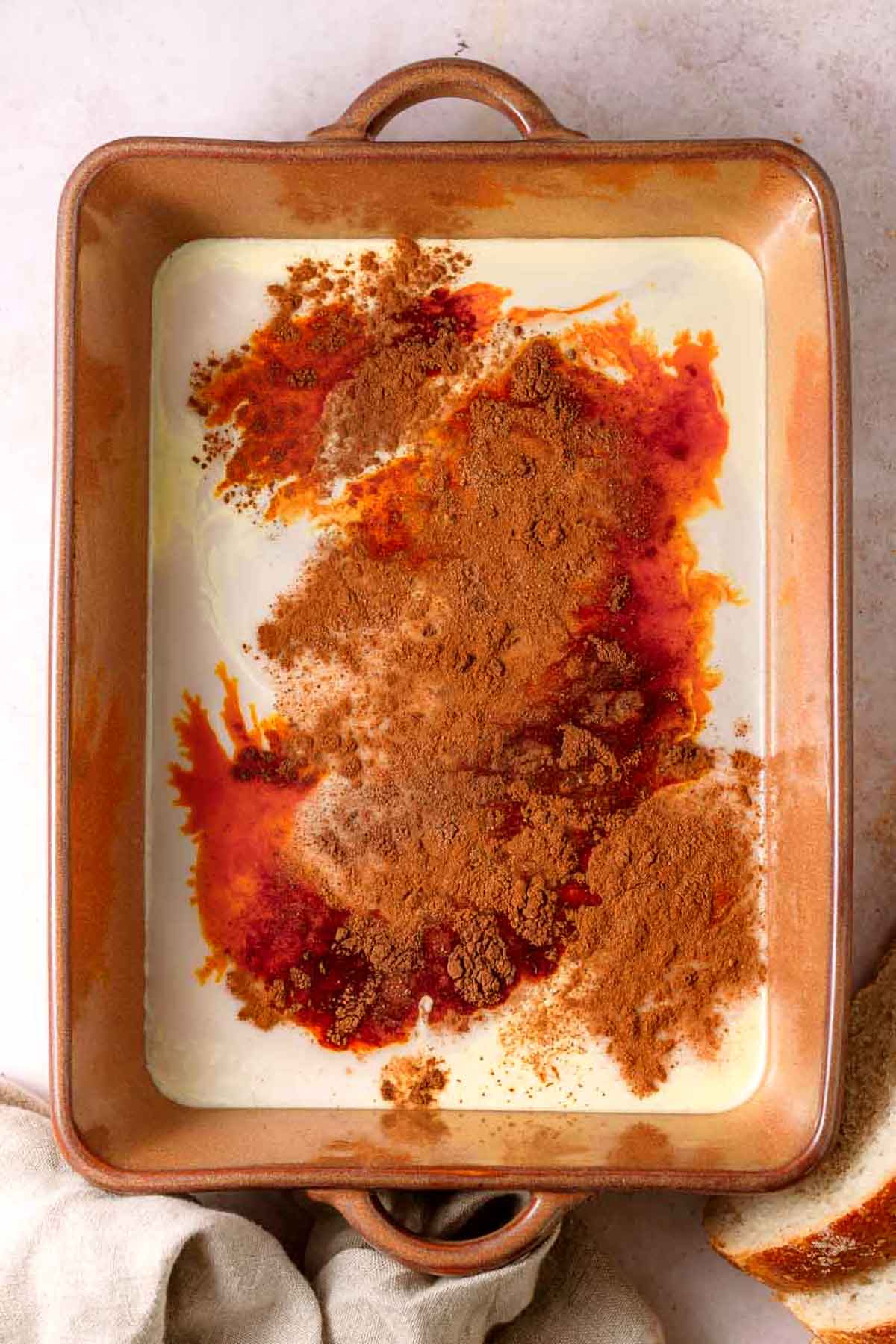 JUST egg custard ingredients in a shallow baking dish.