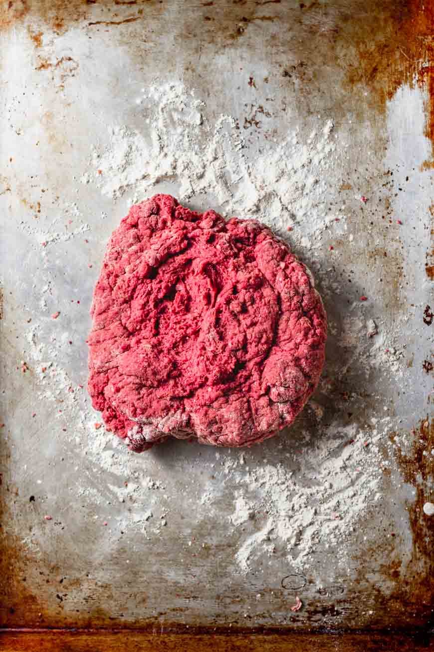a lightly floured surface with the seitan steak dough on it.