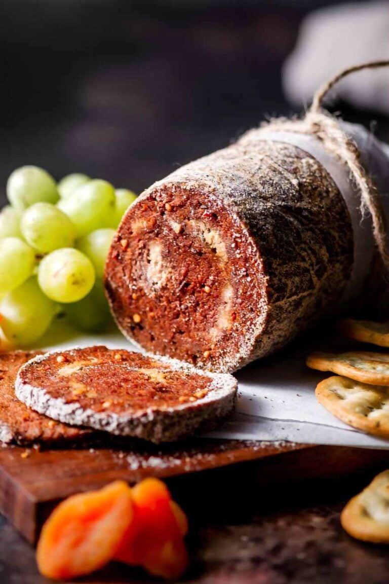 a log of vegan salami coated in a peppercorn crust.