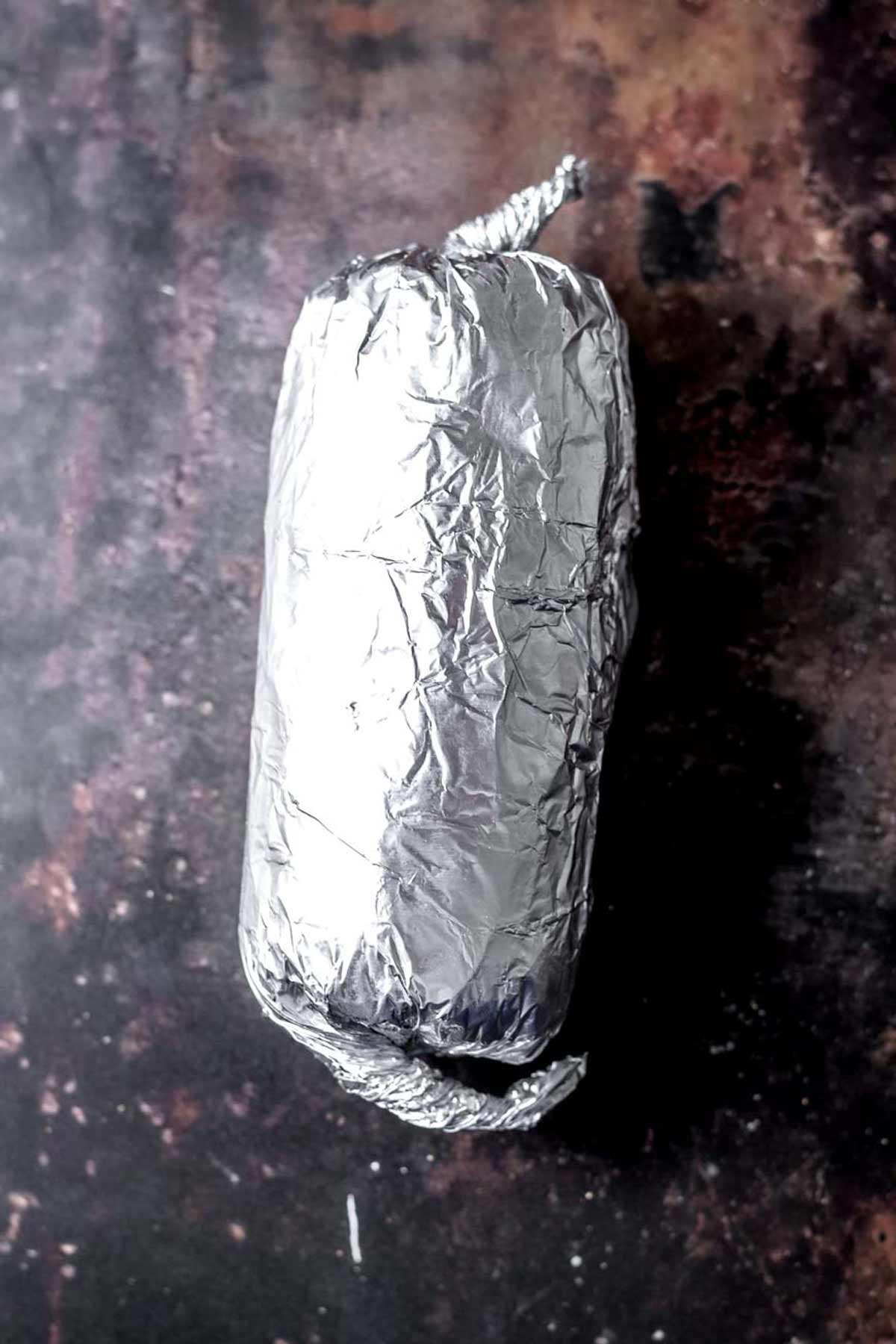 the seitan log rolled in foil ready to bake.