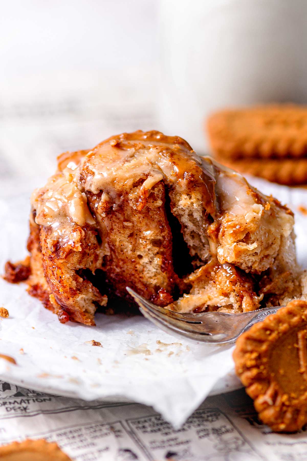 gooey baked biscoff cinnamon rolls with icing.
