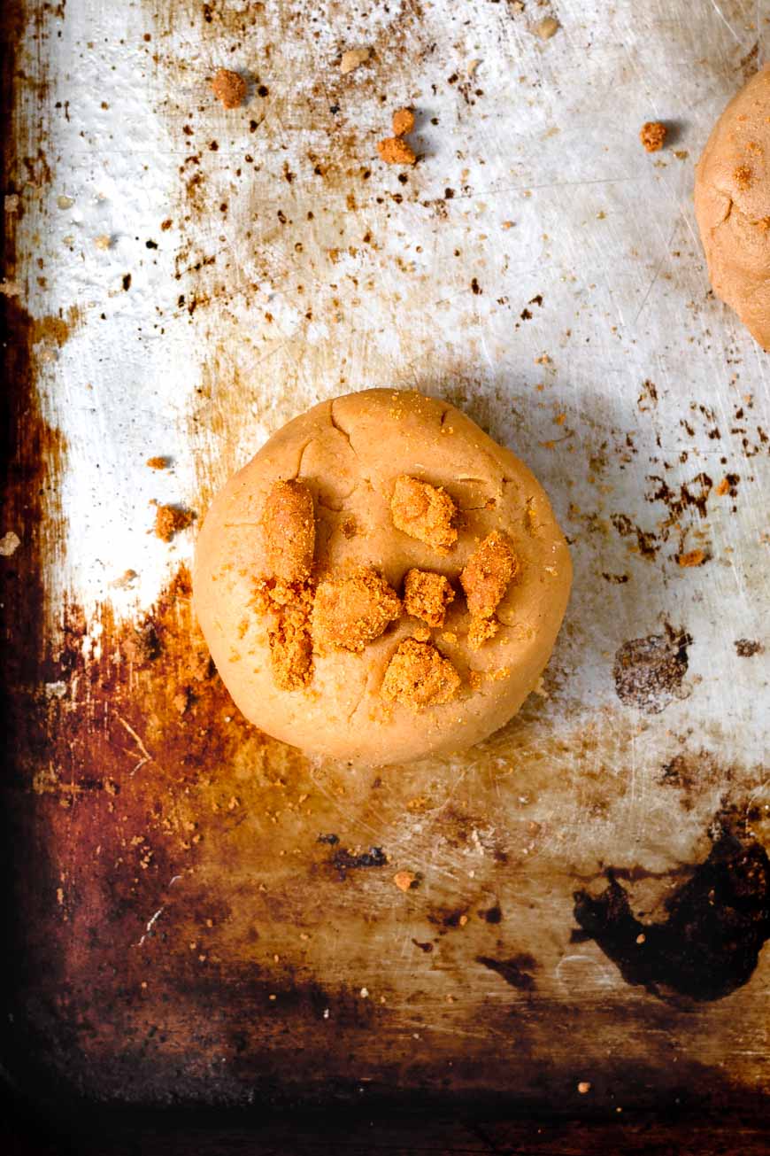 stuffed cookie butter cookie with crushed Biscoff cookies on top.