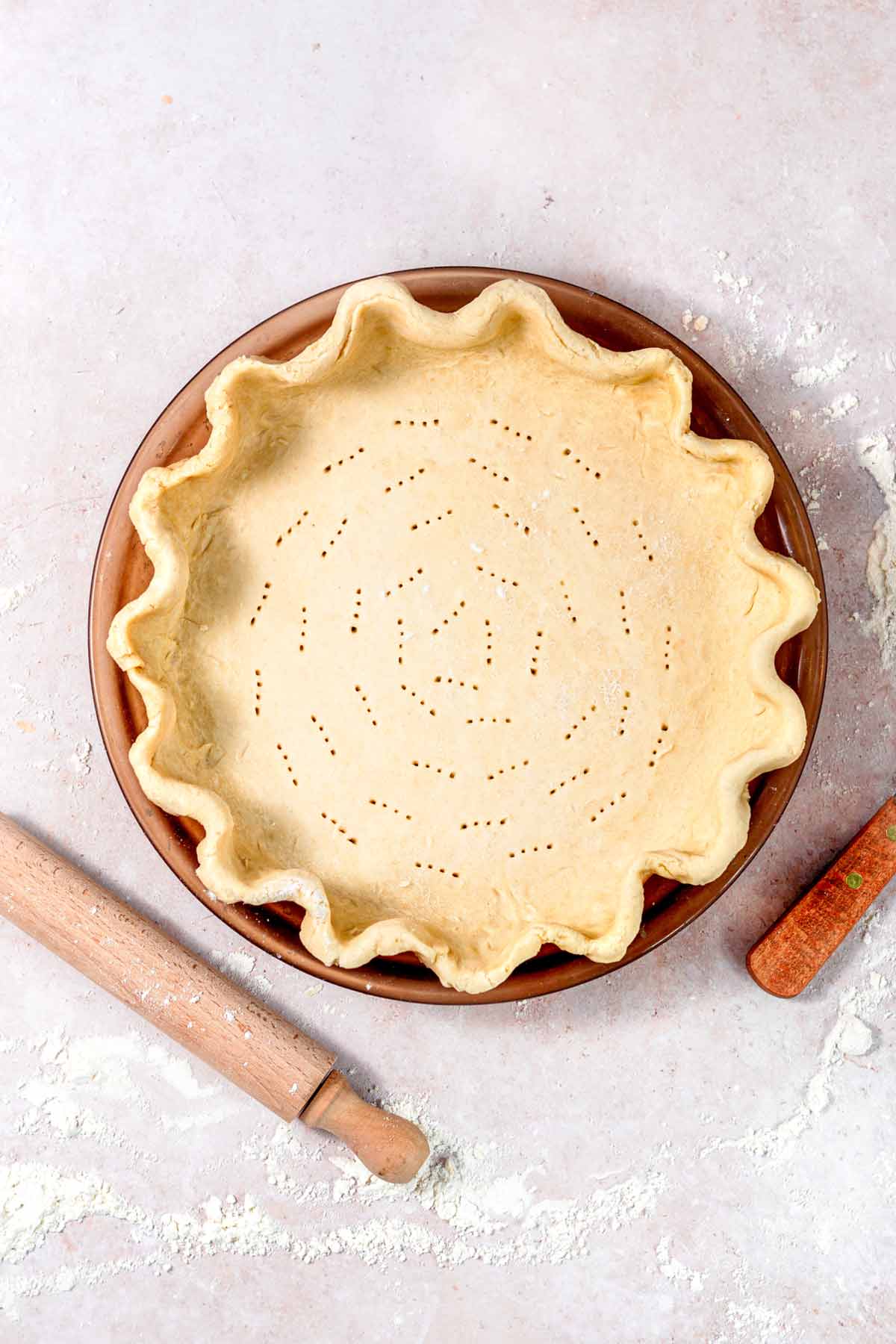 Vegan pie crust in a pie dish.
