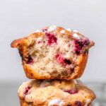 vegan raspberry muffins stacked on each other.