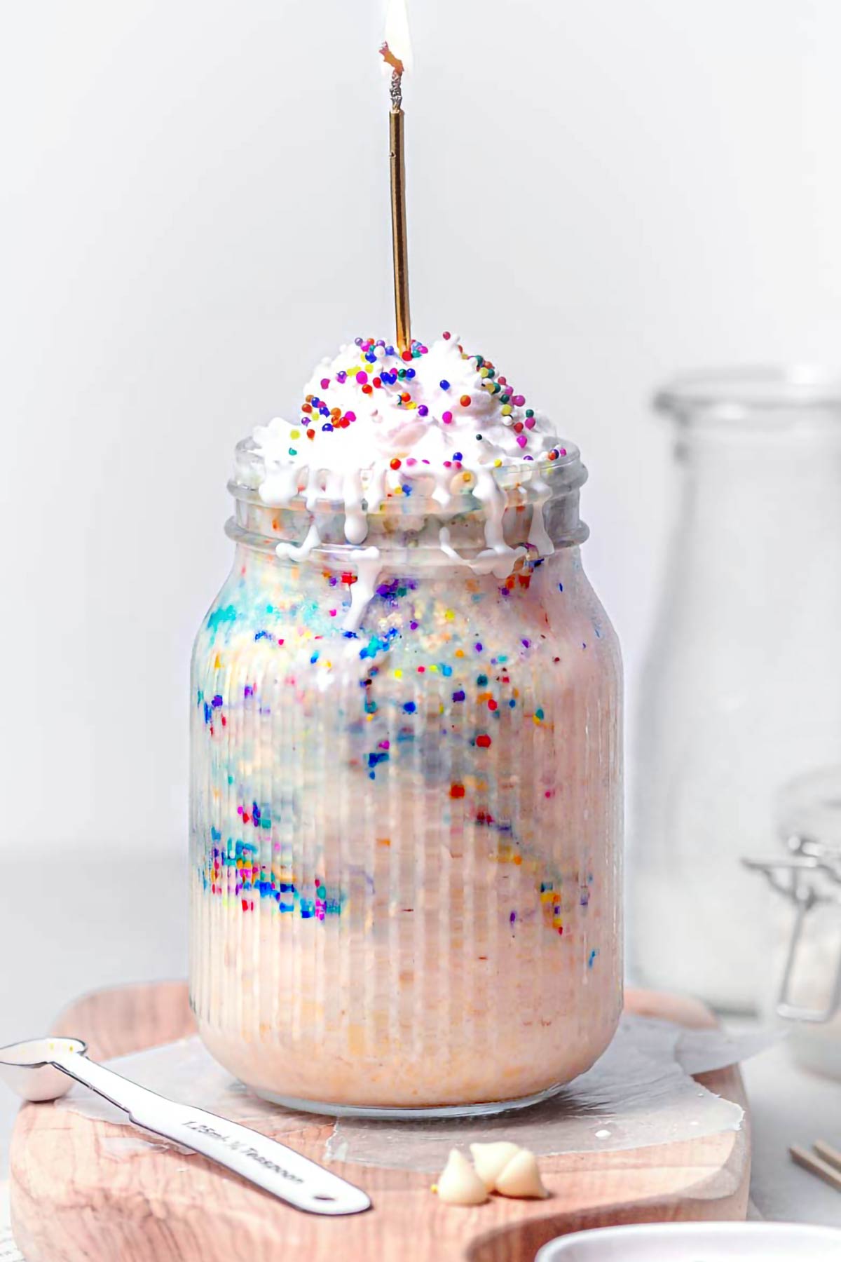 a mason jar filled with funfetti overnight oats.