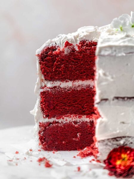 a three layer vegan and egg-free red velvet cake with cream cheese frosting.