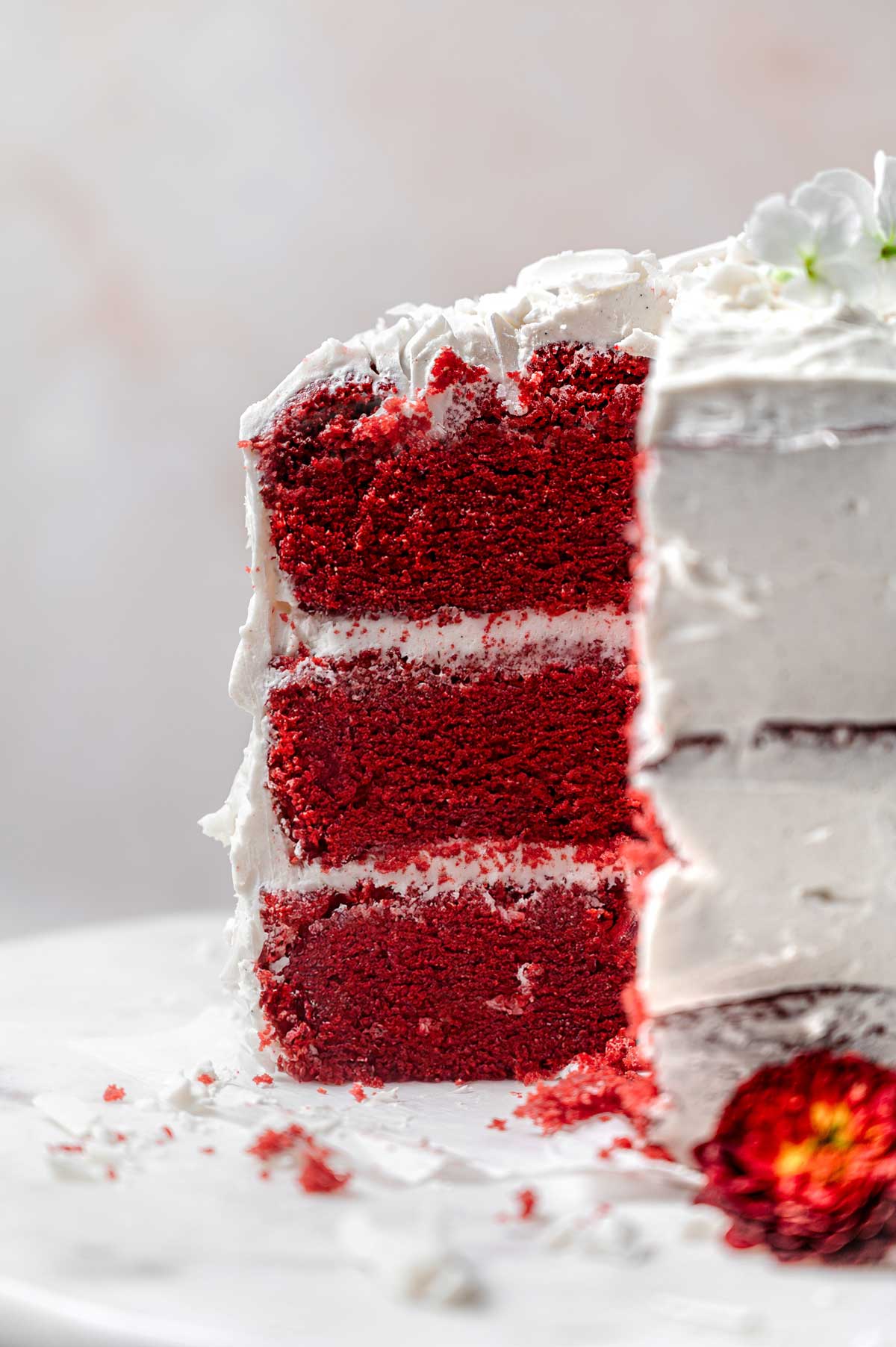 a three layer vegan and egg-free red velvet cake with cream cheese frosting.