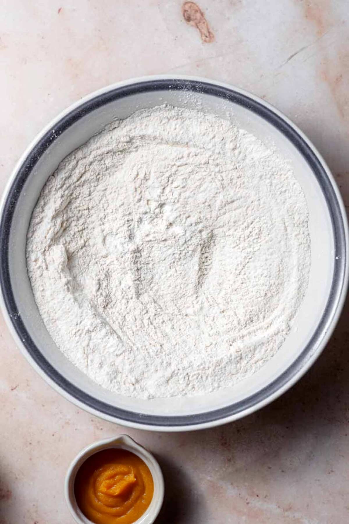 a bowl with dry ingredients for the pancakes.