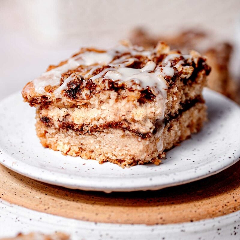 Cinnamon vegan coffee cake with maple icing on topl