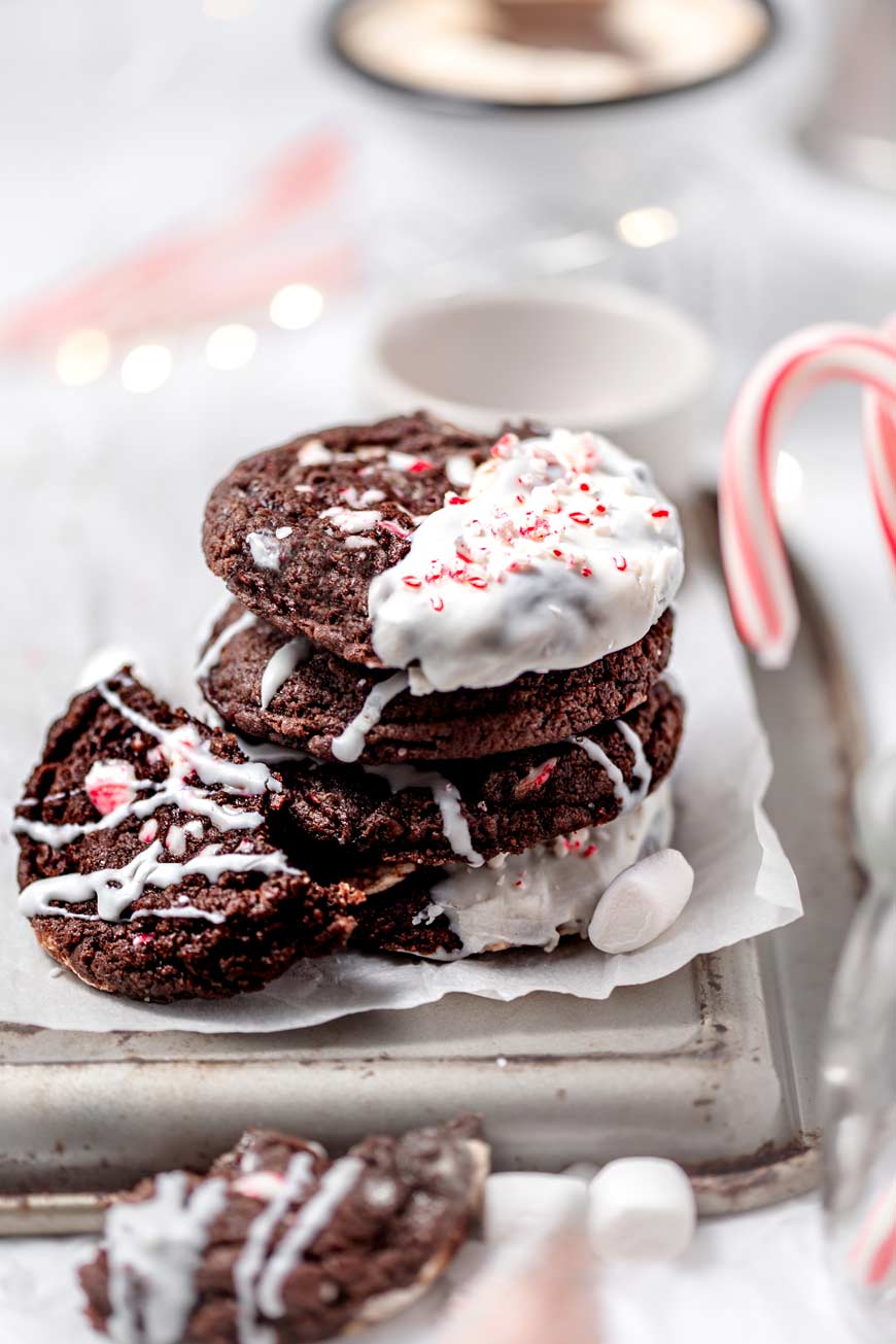 chocolate peppermint mocha cookies with dairy free white chocolate stacked on each other.