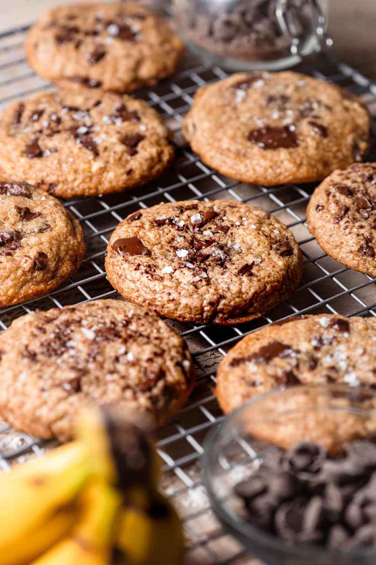 vegan banana chocolate chip cookies on a wire rack.