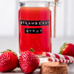 strawberry simple syrup in a jar.