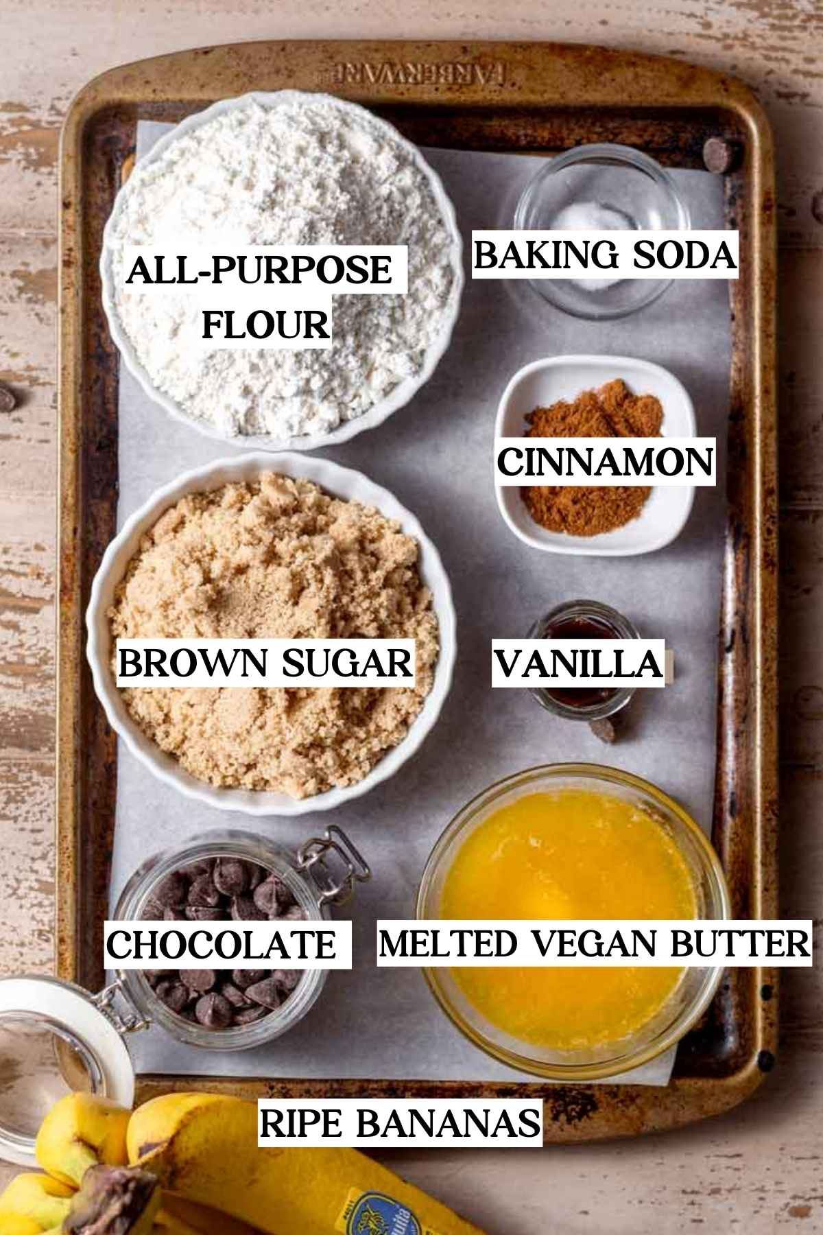 ingredients like flour, melted vegan butter, chocolate chips and brown sugar.