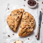 a loaf of vegan Irish soda bread with raisins and caraway seeds.