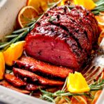 glazed vegan ham made with seitan in a baking dish.