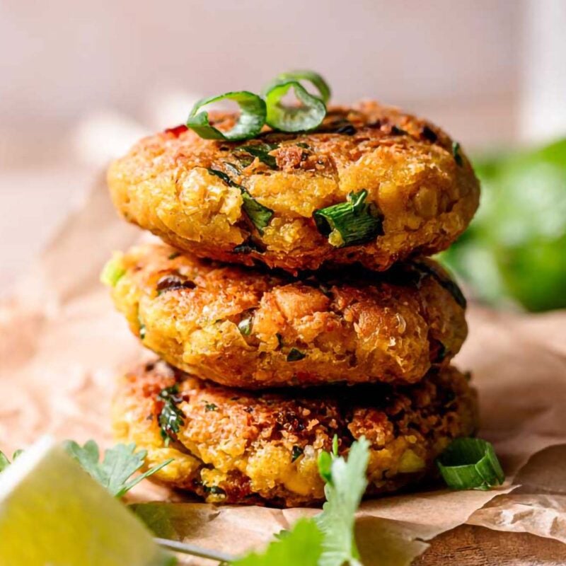 a stack of vegan chickpea patties with green onion.
