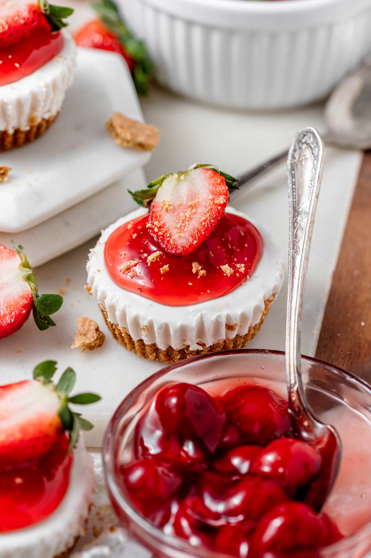 the no bake vegan mini cheesecake with cherry pie filling on top.