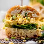vegan JUST egg salad sandwich on ciabatta bread with butter lettuce.