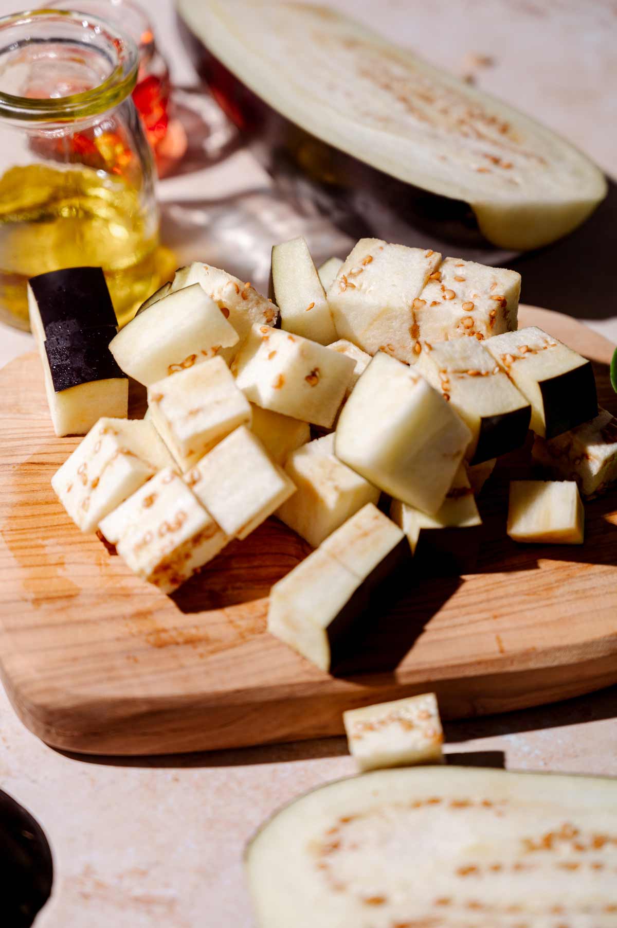 the diced eggplant on a cutting board.