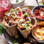 homemade vegan falafel pita sandwiches with hummus in a bowl.