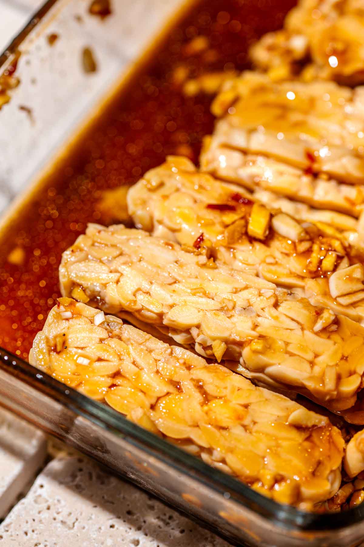 slices of tempeh after marinating.