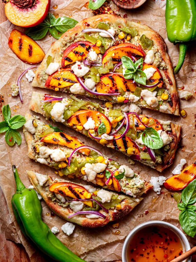 grilled flatbread pizza topped with peaches, basil, hatch chiles and mozzarella.
