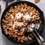 pear crumble recipe with ice cream on top.