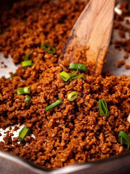 vegan ground beef made with tvp topped with green onion.