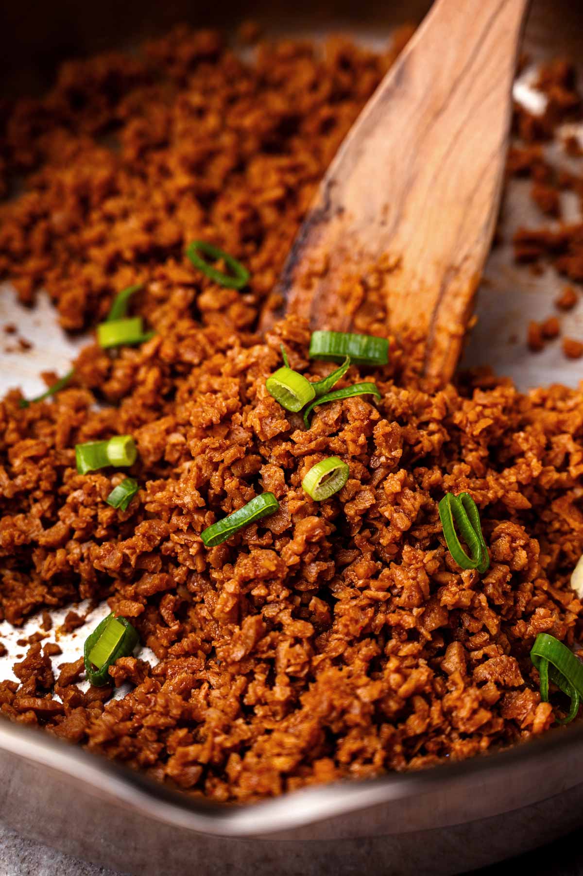vegan ground beef made with tvp topped with green onion.