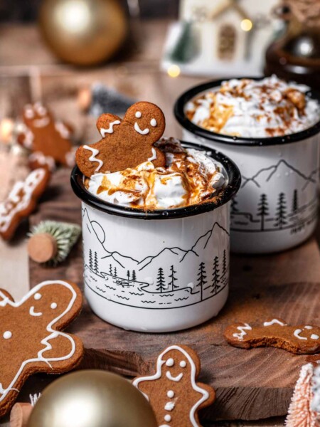 homemade gingerbread latte made with oat milk and topped with coconut whipped cream.