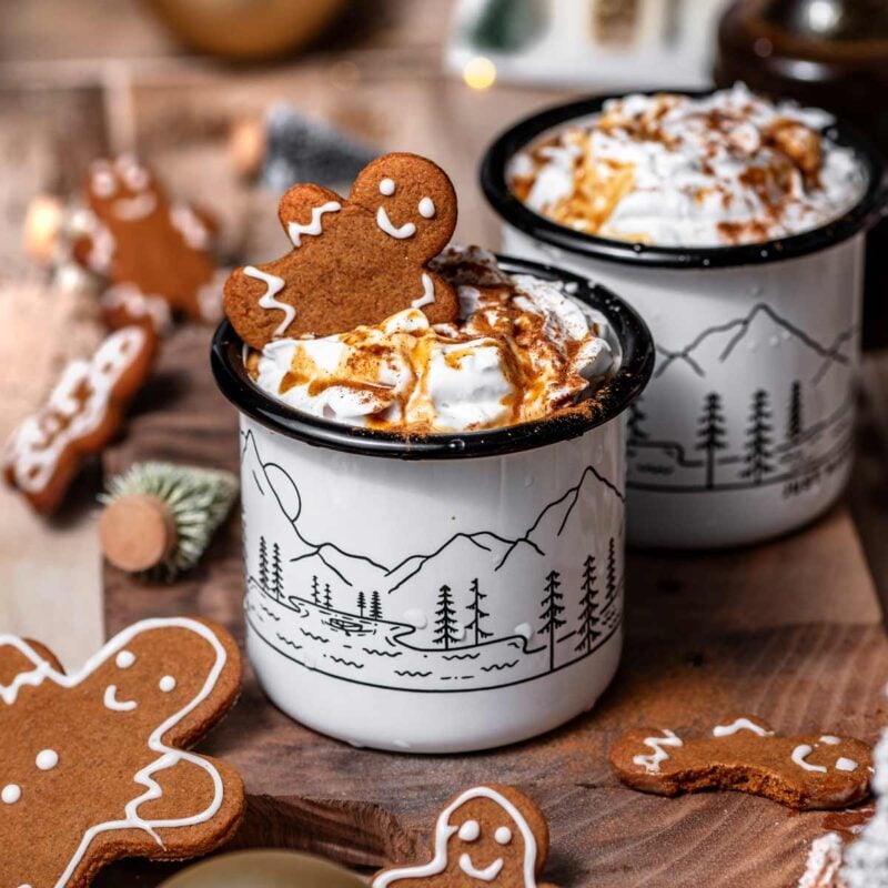 homemade gingerbread latte made with oat milk and topped with coconut whipped cream.