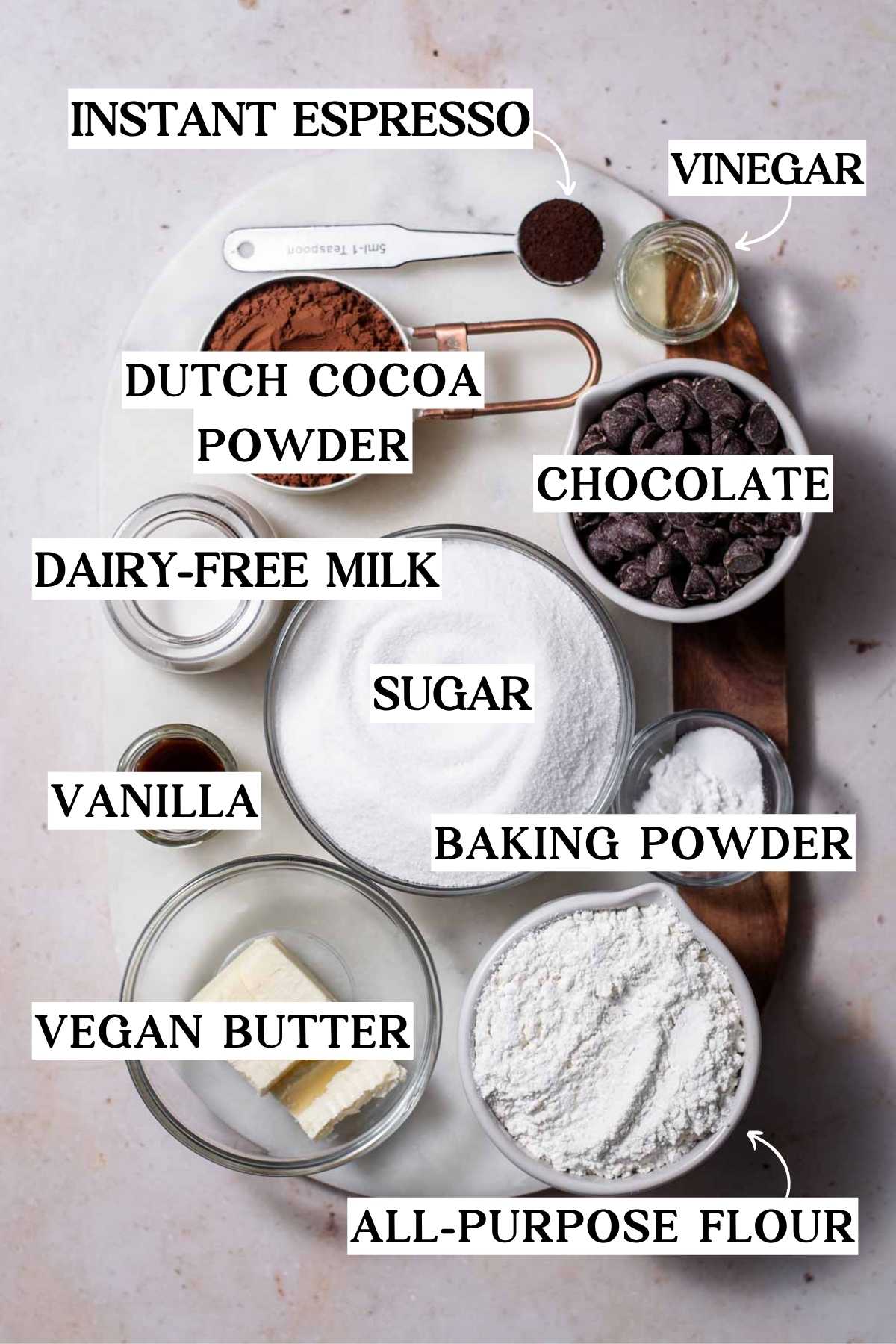 vegan brownie ingredients on a marble cutting board.