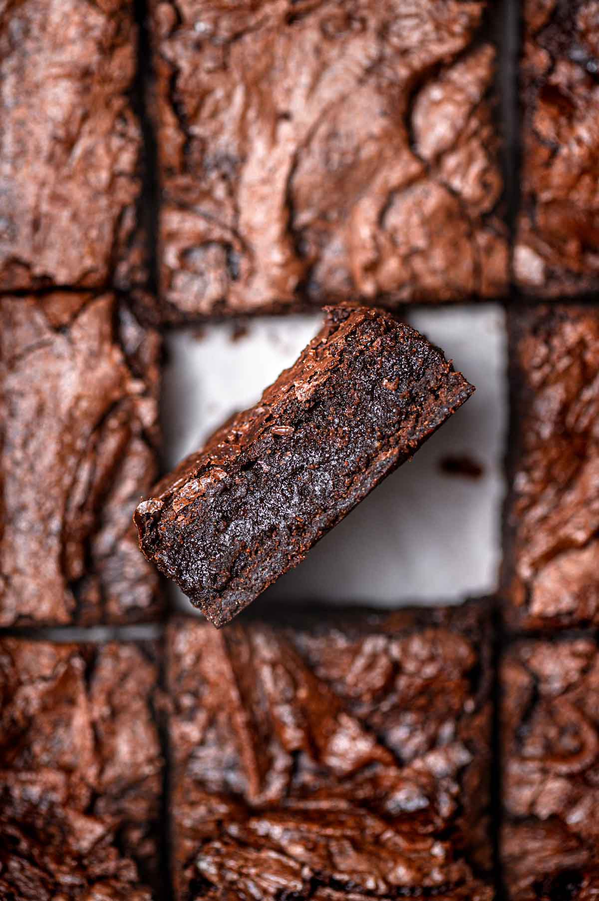 fudgy vegan brownie with a shiny top.