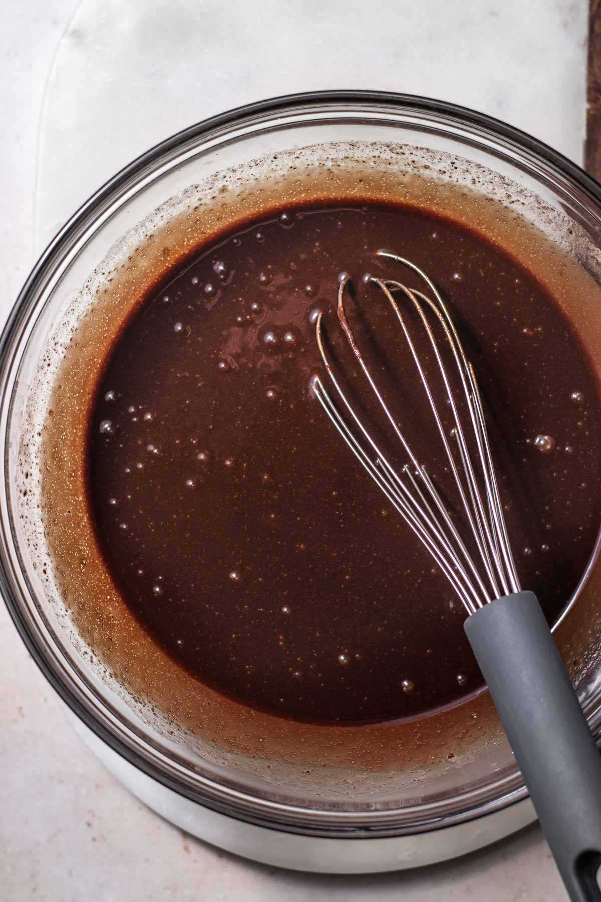 dissolved sugar whisked into the melted butter and chocolate.