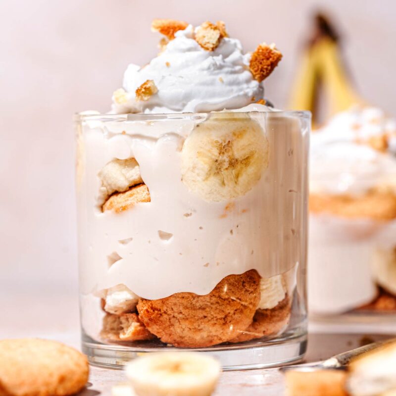 a glass cup filled with vegan banana pudding.
