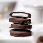 homemade vegan peppermint patties stacked on top of each other.
